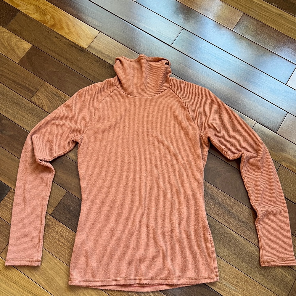 Free people size medium, burnt, orange ribbed turtleneck